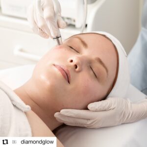 Woman receiving Diamond Glow Facial in an aesthetician's office